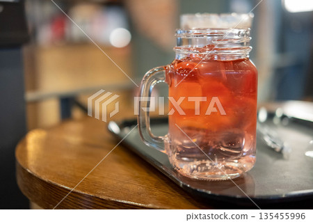 Tropical drink juice in glass jar on the wooden table Tropical drink juice in glass jar on the wooden table 135455996