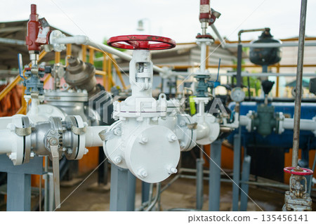 Pressure gauge on industrial pipeline with valve in factory. 135456141