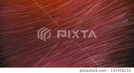 Bewitching Illusion Of Star Trails. Unusual Amazing Stars Effect In Sky. Meteors Trace On Night Dark Blue Sky Background. Large Exposure Bewitching Illusion Of Star Trails. Unusual Amazing Stars Effect In Sky. Meteors Trace On Night Dark Blue Sky Background. Large Exposure 135456218