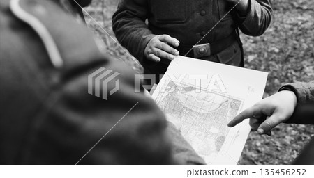 Historical Re-enactment Black And White . World War II German wehrmacht Soldier officer Commander Soldiers Of World War II Briefs, Showing Direction Of A Attack On Map 135456252
