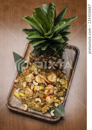 Thai chicken fried rice with pineapple and cashew on modrn bangkok restaurant table in thailand Thai chicken fried rice with pineapple and cashew on modrn bangkok restaurant table in thailand 135456667