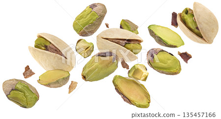 Falling pistachios whole and chopped isolated on white background with clipping path, full depth of field 135457166