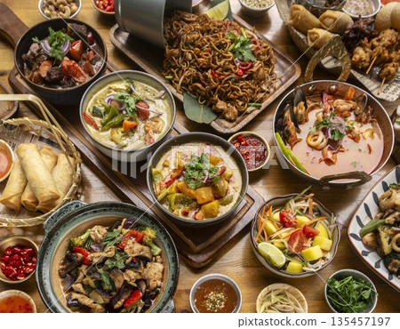 many different thai food dishes on table in modern restaurant in bangkok thailand 135457197