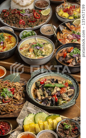 many different thai food dishes on table in modern restaurant in bangkok thailand 135457199