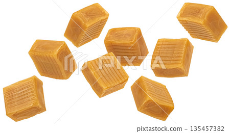 Caramel candy isolated, falling square toffee cubes on white background with clipping path, full depth of field 135457382