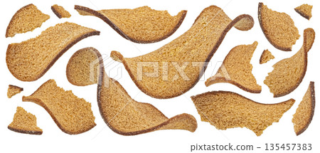 Thin rye bread croutons isolated on white background with clipping path, full depth of field 135457383