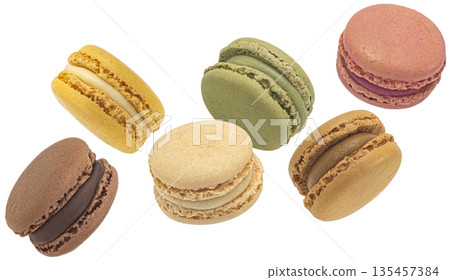 Falling assorted macarons cookies mix isolated on white background, full depth of field 135457384