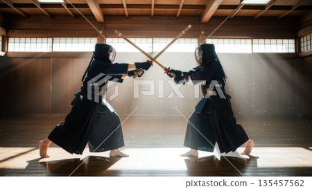 High school boys from the Kendo club vigorously clashing bamboo swords in a dojo bathed in sunlight. High school boys from the Kendo club vigorously clashing bamboo swords in a dojo bathed in sunlight. 135457562
