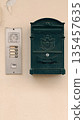 Italian Mailbox and Intercom on Stucco Wall 135457635