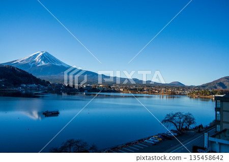 Lake Kawaguchi in winter and Mount Fuji reflected on its calm surface Lake Kawaguchi in winter and Mount Fuji reflected on its calm surface 135458642
