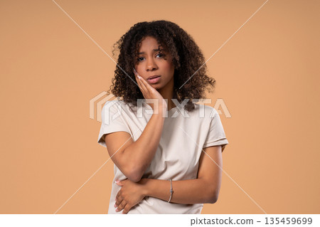 Young Teenage Girl With Tooth Pain, Beige Background. Toothache, Dental Problem Young Teenage Girl With Tooth Pain, Beige Background. Toothache, Dental Problem 135459699