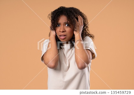 African Woman Afraid Something, Shock On Beige Backdrop.unbelievable, Bad News 135459729