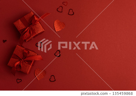 Red Glitter Gift Boxes and Hearts on Festive Background for Valentine's Day Celebration Red Glitter Gift Boxes and Hearts on Festive Background for Valentine's Day Celebration 135459868
