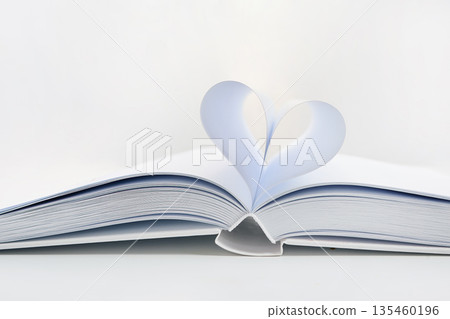 Open book showing heart shape with paper pages 135460196