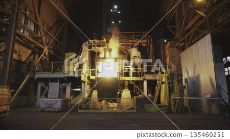 Molten metal pouring in steel plant at night. Stock clip Molten metal pouring in steel plant at night. Stock clip 135460251
