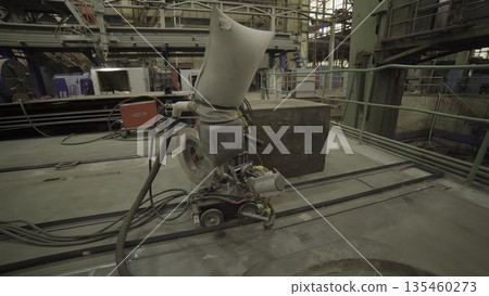 Automated grinding machine smoothing metal surface in factory. Stock clip 135460273