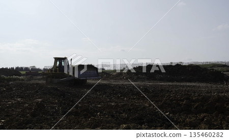 Bulldozer moving soil on construction site. Clip Bulldozer moving soil on construction site. Clip 135460282