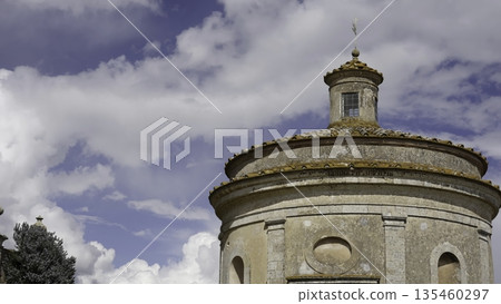 Majestic temple of the holy sepulcher in pisa under cloudy sky. Action Majestic temple of the holy sepulcher in pisa under cloudy sky. Action 135460297
