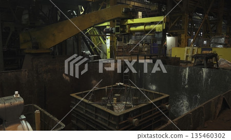 Industrial manufacturing process of pouring molten metal into mold. Stock clip Industrial manufacturing process of pouring molten metal into mold. Stock clip 135460302