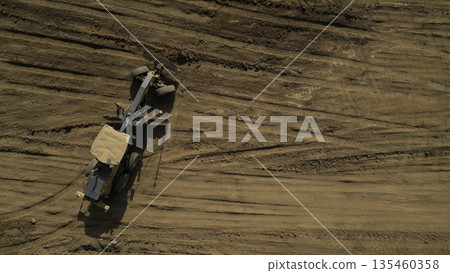 Grader leveling ground on construction site. Clip 135460358