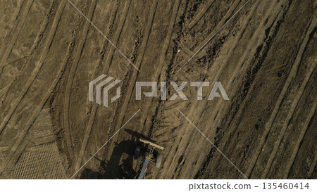 Grader leveling ground on construction site. Clip Grader leveling ground on construction site. Clip 135460414