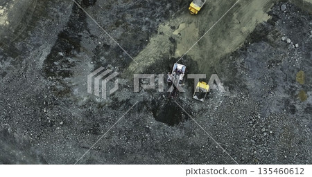 Mining truck unloading gravel into a pit at a quarry. Stock clip 135460612
