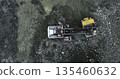 Mining truck unloading rocks into dump truck at quarry. Stock clip 135460632