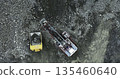 Excavator loads a dump truck in a quarry. Stock clip 135460640