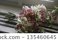 A Stunning and Beautiful Floral Bouquet Displayed on a Bright Windowsill in a Lovely Home setting. Action 135460645