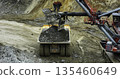 Excavator loading dump truck in open pit mine. Stock clip 135460649