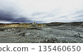 Mining landscape showing eroded terrain and cloudy sky. Stock clip 135460650