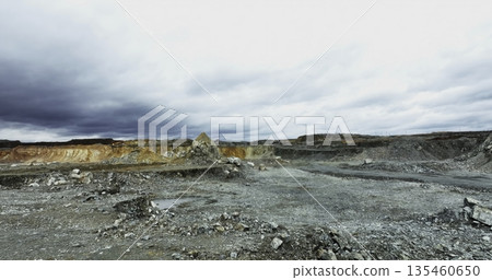 Mining landscape showing eroded terrain and cloudy sky. Stock clip 135460650