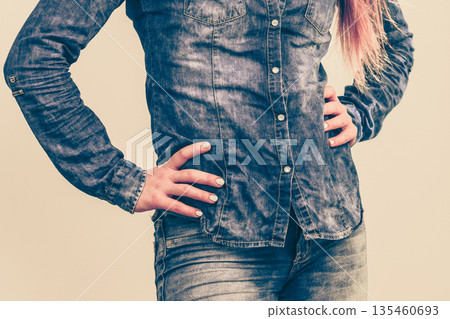 Woman in denim jeans shirt Woman in denim jeans shirt 135460693