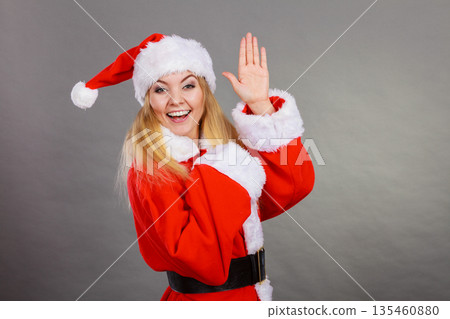 Happy woman wearing Santa Claus helper costume Happy woman wearing Santa Claus helper costume 135460880