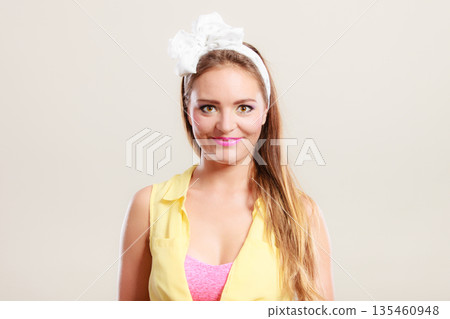 Portrait of happy pretty pin up girl with bow. Portrait of happy pretty pin up girl with bow. 135460948
