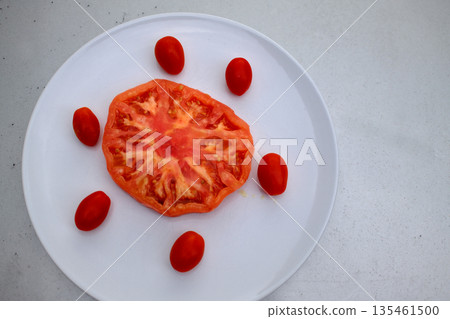 Red raw tomatoes served fresh as natural and healthy food. 135461500