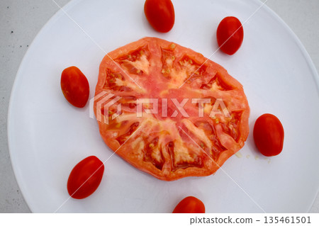 Red raw tomatoes served fresh as natural and healthy food. Red raw tomatoes served fresh as natural and healthy food. 135461501