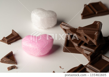 Valentine's Day preparation image: broken chocolate bar and heart decoration Valentine's Day preparation image: broken chocolate bar and heart decoration 135461605
