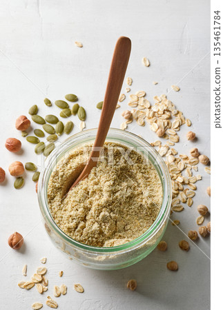 jar of plant based protein powder 135461784