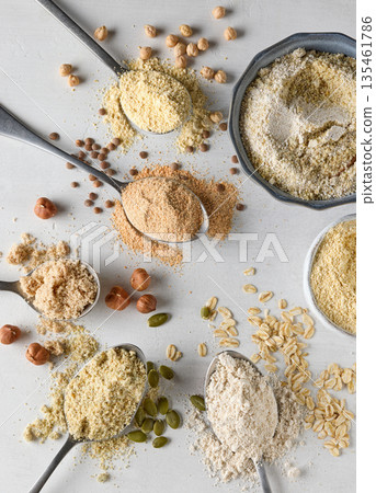 spoons of various plant based protein powders 135461786