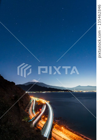 Fifty-three Stations of the Tokaido: Night view of Mount Fuji and the Tokaido illuminated by moonlight from Sattata Pass 135462846