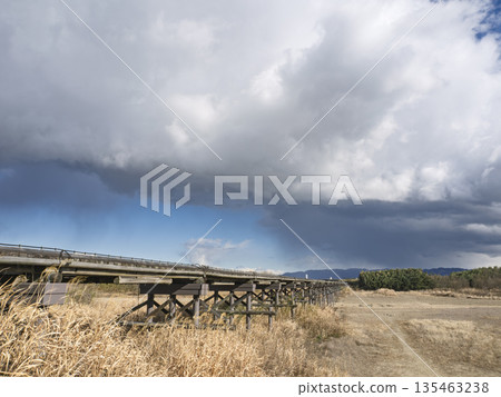 A traditional Kyoto landscape: a wooden bridge stretching beneath the clouds A traditional Kyoto landscape: a wooden bridge stretching beneath the clouds 135463238
