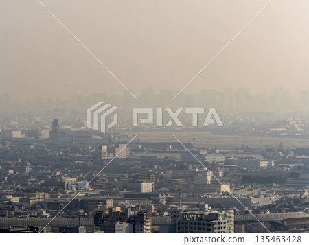 Airport and city buildings covered in yellow sand Airport and city buildings covered in yellow sand 135463428