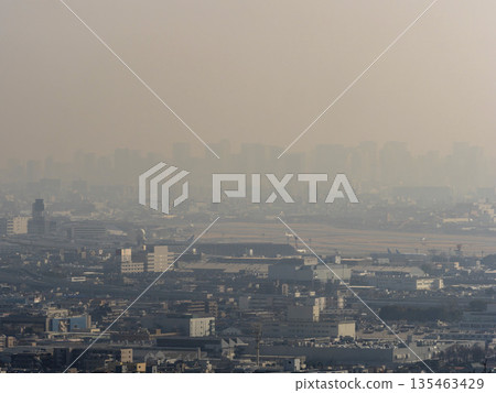 Airport and city buildings covered in yellow sand Airport and city buildings covered in yellow sand 135463429