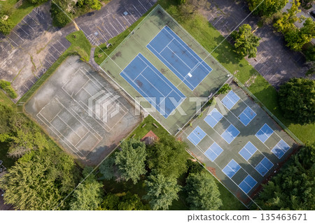 A tennis court with two courts, one of which is empty. Chesterbrook, USA 135463671