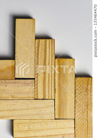 Top view of natural wood building blocks arranged in a staircase-like pattern. Ideal for representing concepts such as growth, business strategy, career steps, and construction planning Top view of natural wood building blocks arranged in a staircase-like pattern. Ideal for representing concepts such as growth, business strategy, career steps, and construction planning 135464470