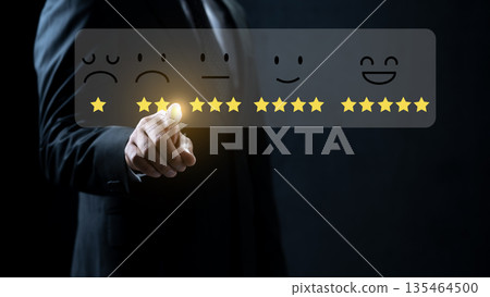 Professional businessman interacting with a digital interface for customer feedback. Virtual display showing star icons and facial expressions to evaluate service satisfaction and quality Professional businessman interacting with a digital interface for customer feedback. Virtual display showing star icons and facial expressions to evaluate service satisfaction and quality 135464500