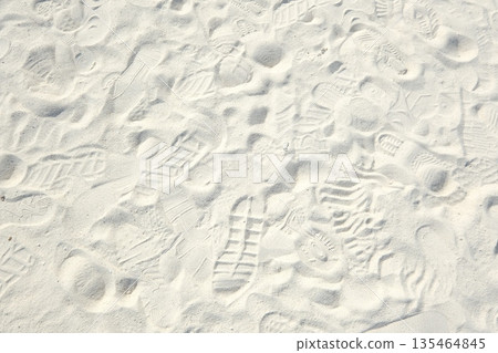 Footprints on the sand of a remote island beach Footprints on the sand of a remote island beach 135464845