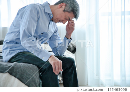 Senior man worried 135465096