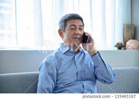 Senior male to talk on a smartphone Senior male to talk on a smartphone 135465187